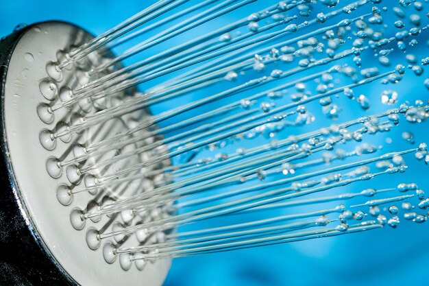 A close-up of a WaterSense labeled low-flow showerhead, emphasizing water efficiency.