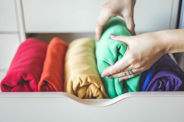 Close-up of hands carefully sorting laundry into different colored baskets, highlighting the importance of proper color separation for preserving clothing.