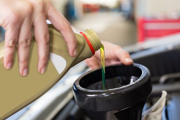 A close-up of someone changing a car's oil filter, with a wrench and various oil bottles in the background.