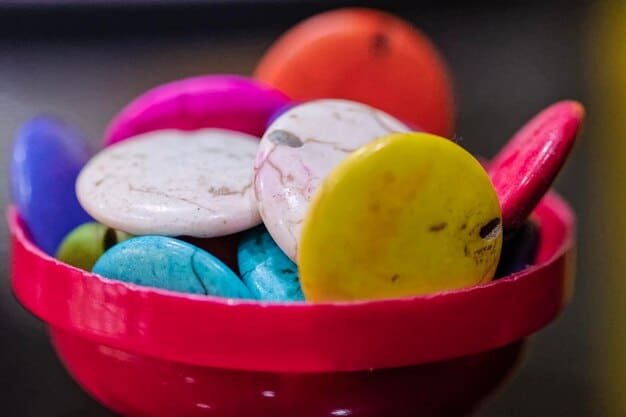 A close-up shot of a variety of homemade lip balms in small, colorful containers, showcasing natural and vibrant colors.