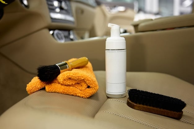 A close-up shot of various car cleaning products, including car wash soap, tire shine, glass cleaner, and interior protectant, arranged neatly on a table.