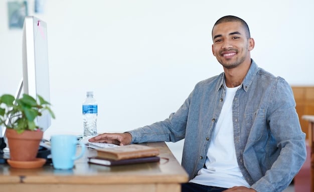 A person sitting at a desk with a laptop, using a tax preparation software and smiling confidently.