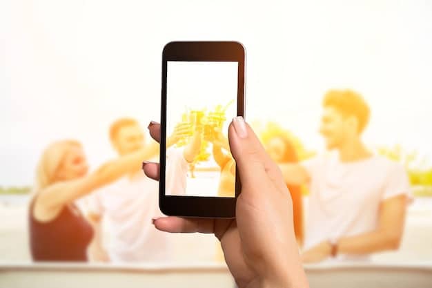 A person's hand holding a smartphone, displaying a vivid app interface with a large 
