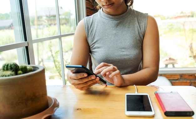 A person using a smartphone app to track their daily expenses. The app displays categories like 