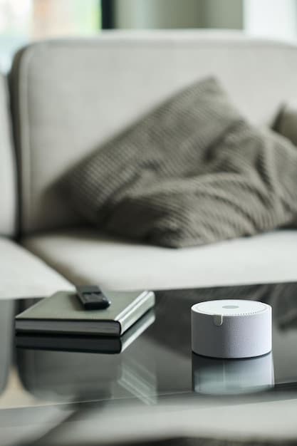 A smart thermostat displaying an energy-saving temperature, with a blurred background of a modern living room.