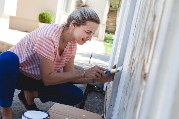 A person installing new weatherstripping around a closed door frame, highlighting a practical and easy DIY energy-saving home improvement.