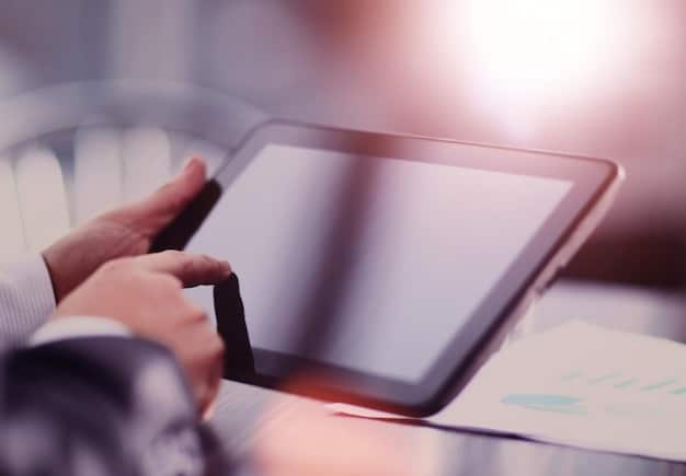 A close-up of hands filling out a digital application form on a tablet, with a stylized background depicting simplified financial flow and relief.