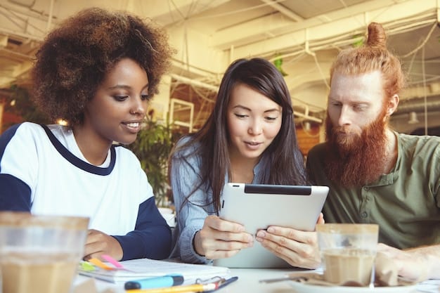 A diverse group of people discussing personal finance on laptops and tablets in a modern, collaborative workspace, representing community support and shared learning in budgeting.