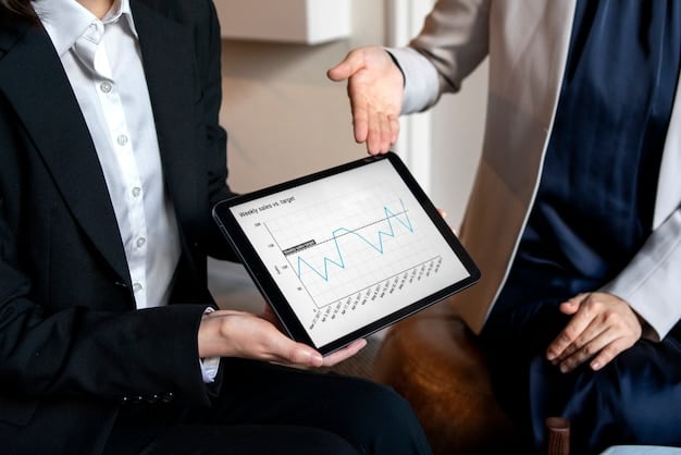 A financial advisor explaining interest rate charts on a tablet to a client, with clear graphics comparing different debt rates.